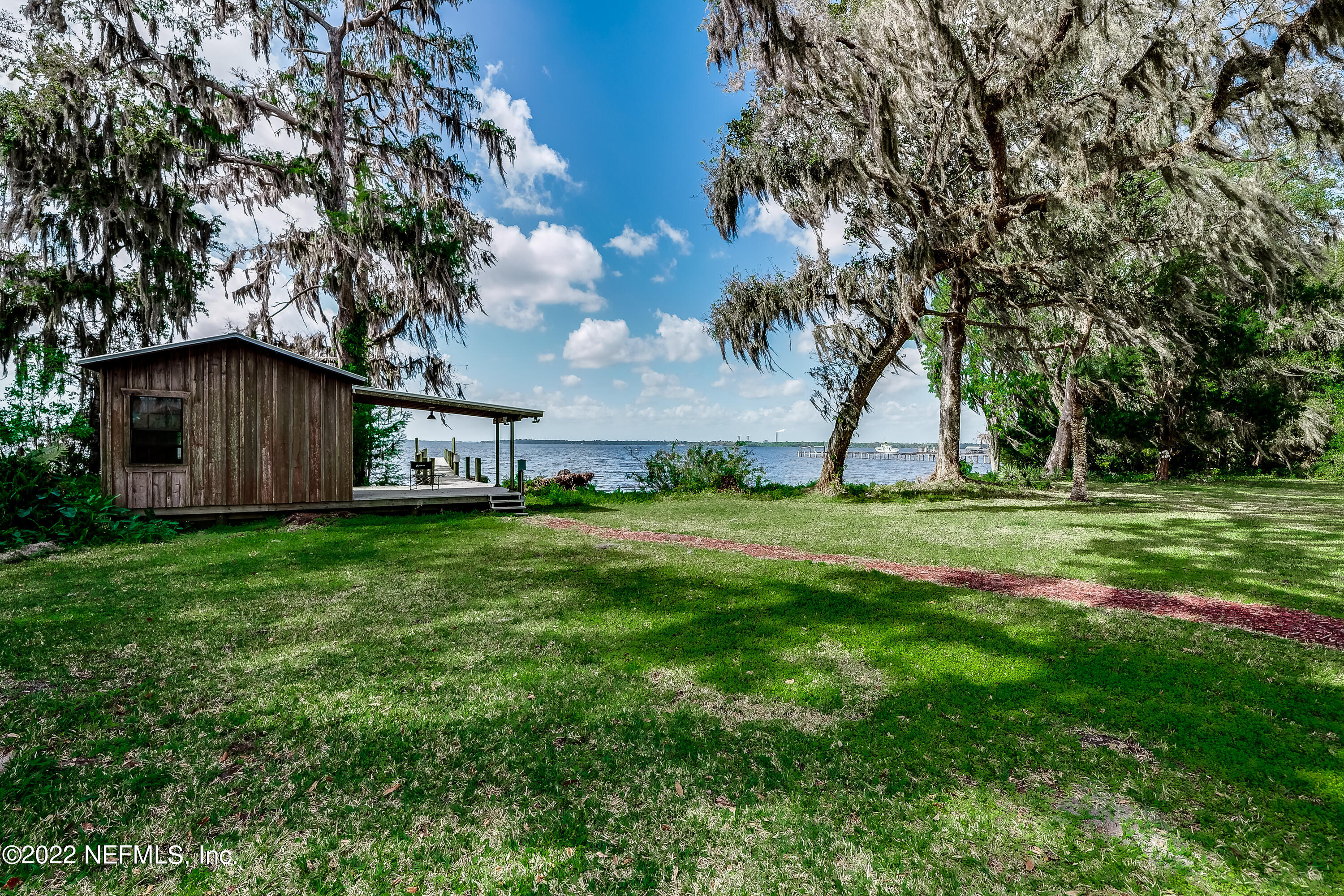 541 Federal Point Road East Palatka, FL 32131 - Photo 54 of 75 a view of a house with backyard and a tree