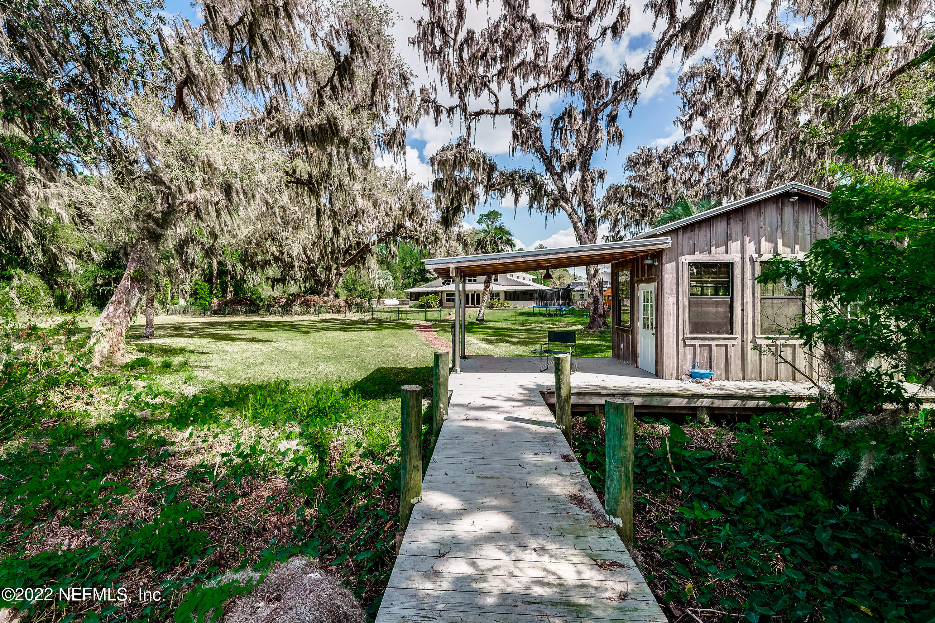 541 Federal Point Road East Palatka, FL 32131 - Photo 57 of 75 a front view of a house with a yard table and chairs