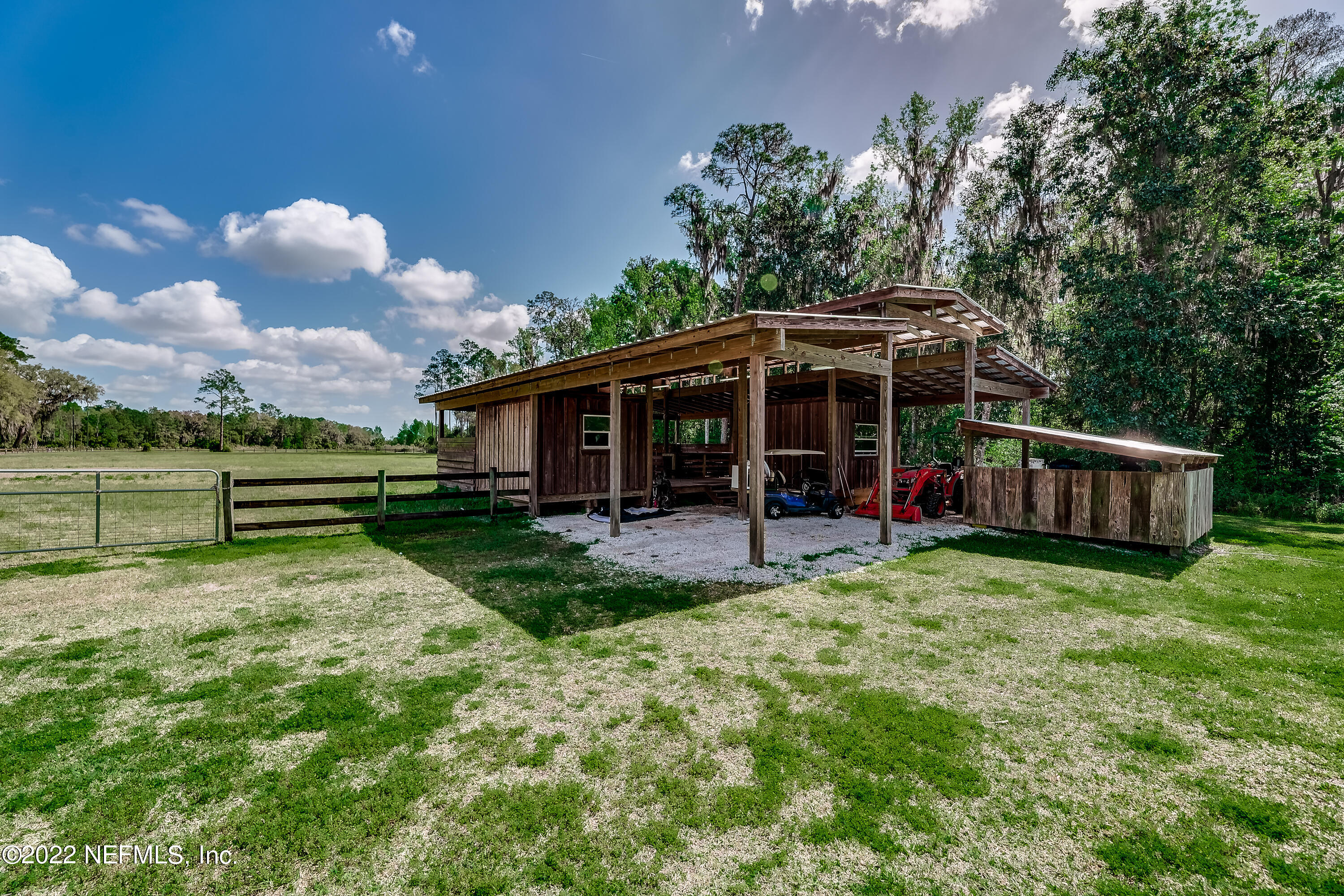 541 Federal Point Road East Palatka, FL 32131 - Photo 70 of 75 a view of a house with yard and a garden