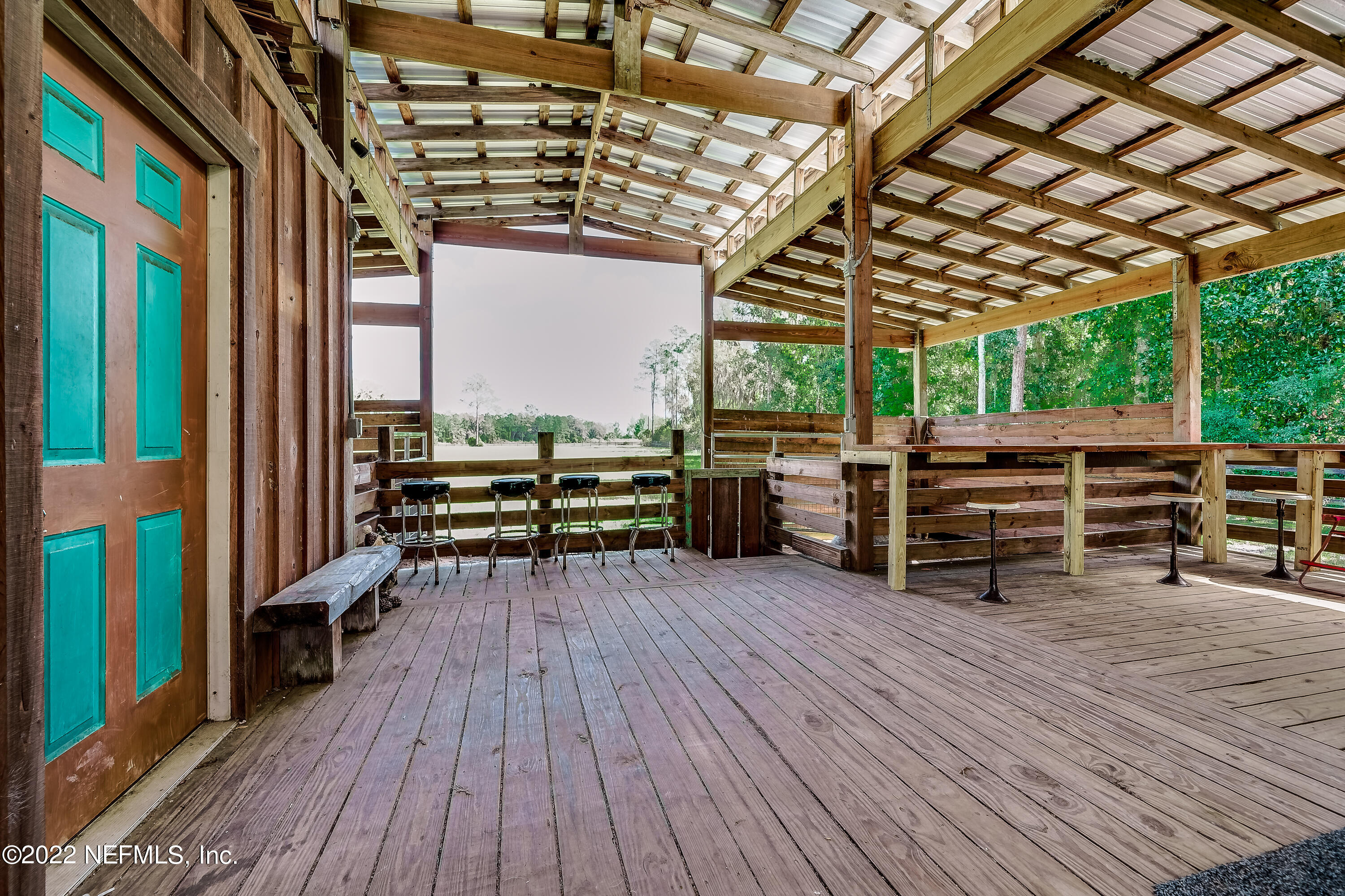 541 Federal Point Road East Palatka, FL 32131 - Photo 73 of 75 a view of a big room with wooden floor and furniture