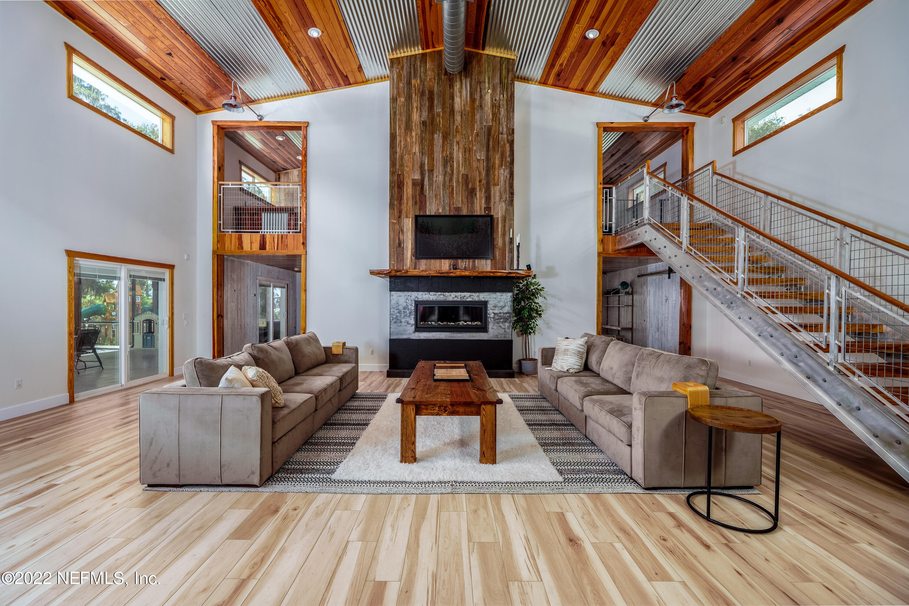 541 Federal Point Road East Palatka, FL 32131 - Photo 8 of 75 a living room with furniture and a fireplace