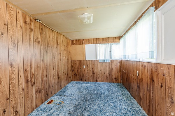 365 West 200 North Logan, UT 84321 - Photo 28 of 45 Room featuring wood-finish paneling walls and multiple windows