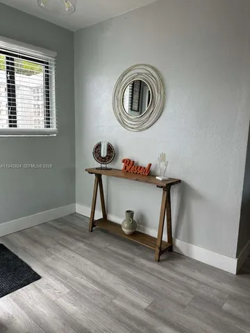 a view of a livingroom with a furniture and wooden floor