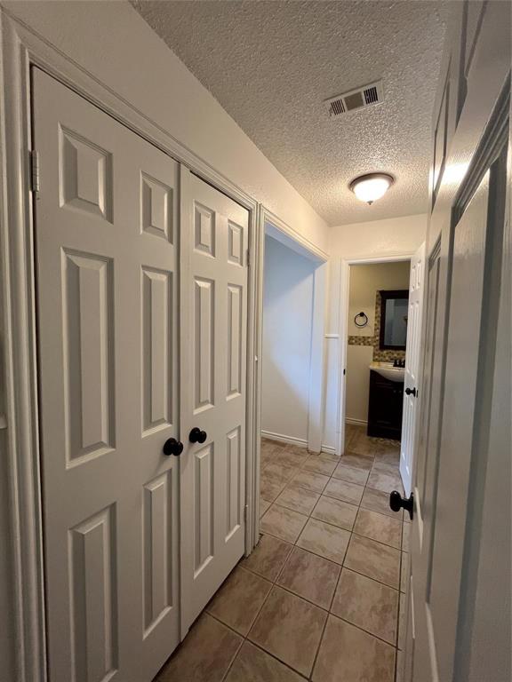 9644 Deer Park Road Quinlan, TX 75474 - Photo 18 of 25 a view of a hallway with a livingroom