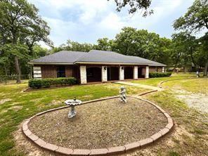 9644 Deer Park Road Quinlan, TX 75474 - Photo 2 of 25 a view of a house with swimming pool