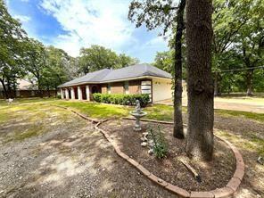 9644 Deer Park Road Quinlan, TX 75474 - Photo 3 of 25 a view of a house with a yard balcony and sitting area
