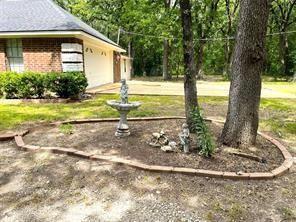 9644 Deer Park Road Quinlan, TX 75474 - Photo 4 of 25 a view of a house with backyard and trees