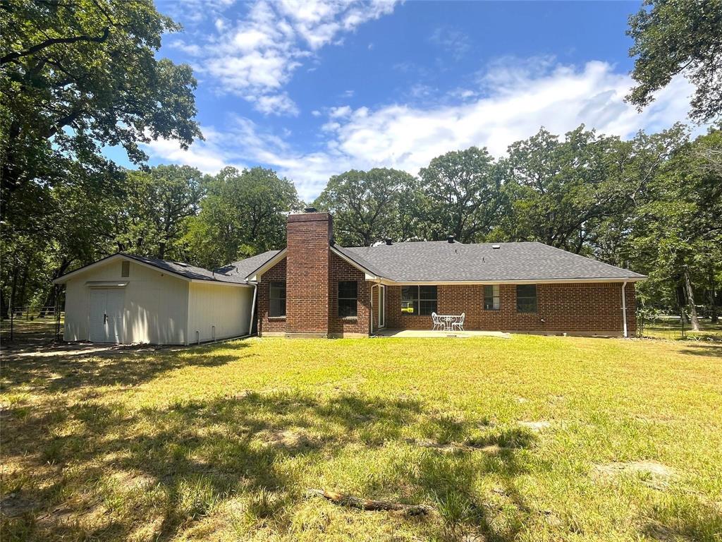 9644 Deer Park Road Quinlan, TX 75474 - Photo 6 of 25 a view of a house with a yard