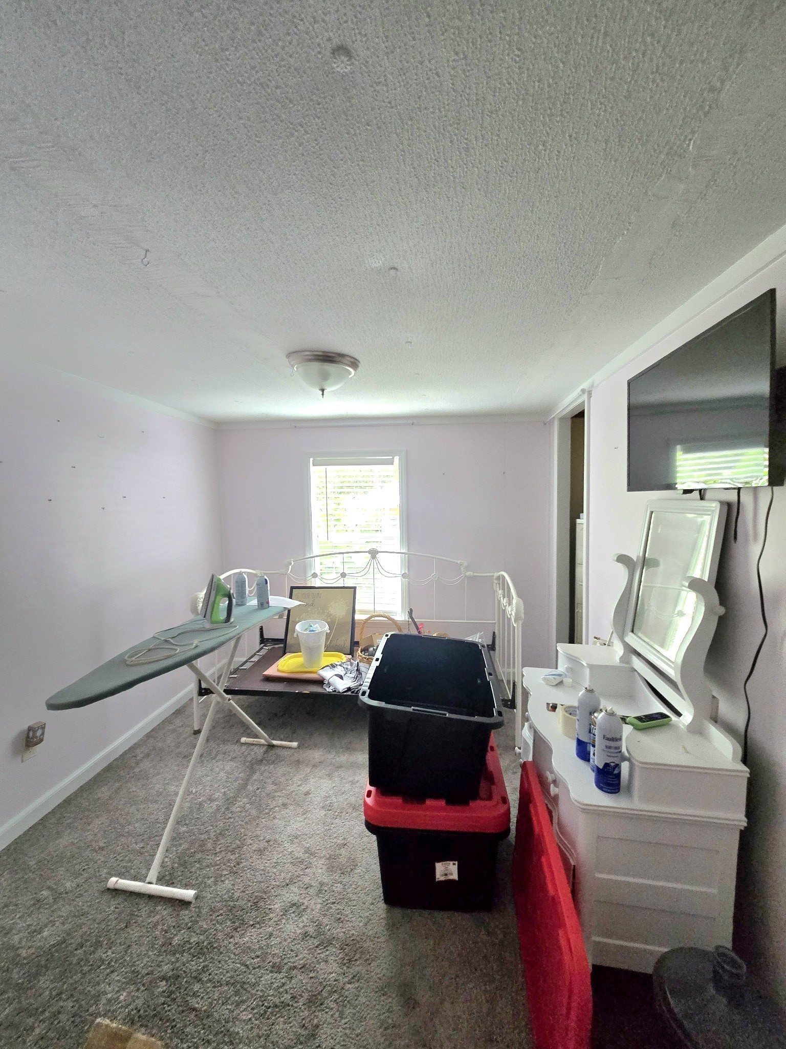 157 Longbranch Road Hohenwald, TN 38462 - Photo 14 of 16 a bedroom with furniture and a window