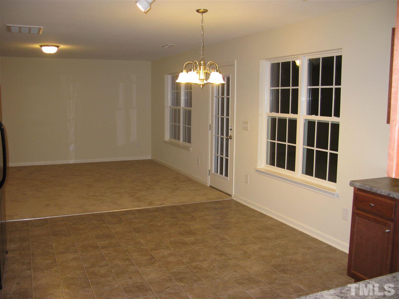 6833 Planting Court Raleigh, NC 27610 - Photo 7 of 18 a view of an empty room with a window