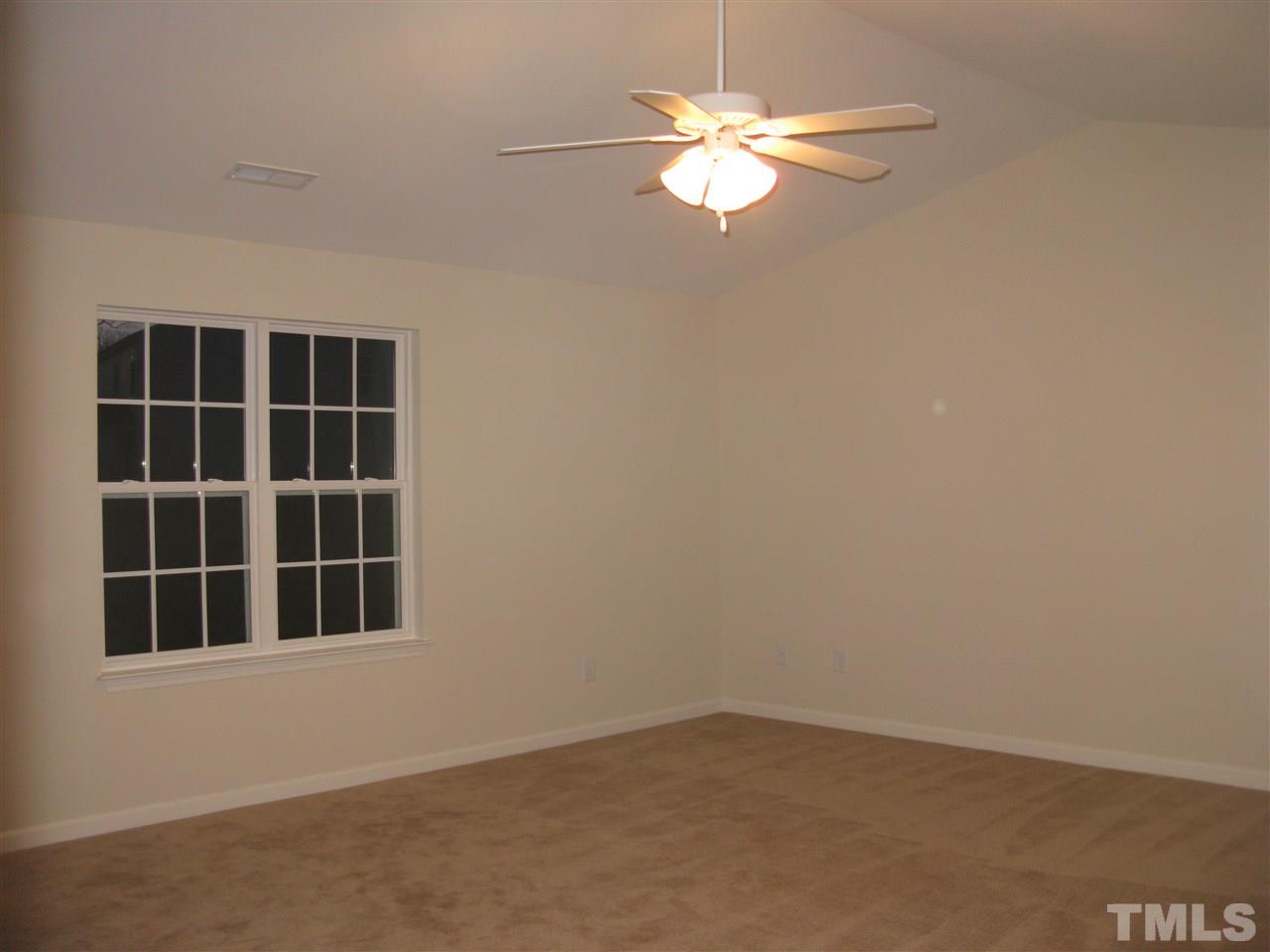 6833 Planting Court Raleigh, NC 27610 - Photo 9 of 18 an empty room with a window