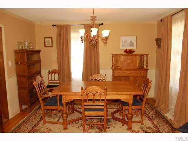 6413 Arrington Road Raleigh, NC 27607 - Photo 3 of 12 Formal dining room with hardwood floors and crown and chair rail molding. Dining Room
