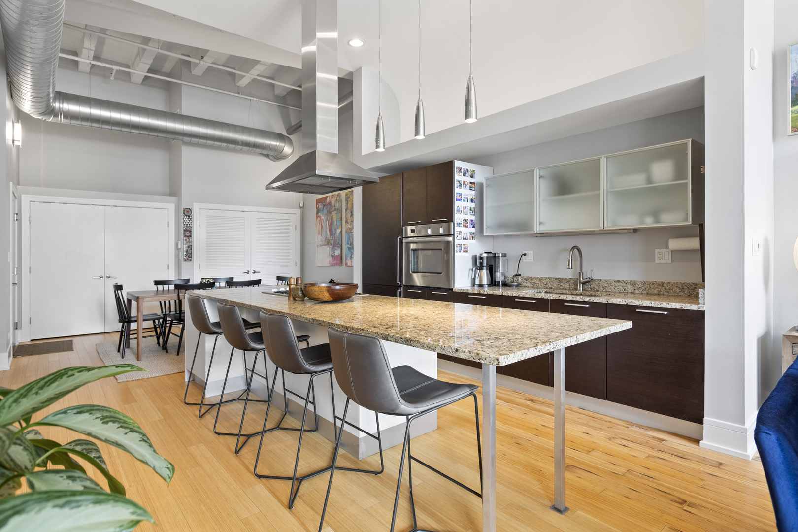 1800 Ridge Avenue, Unit 102 Evanston, IL 60201 - Photo 8 of 26 a dinning table and chairs in a kitchen