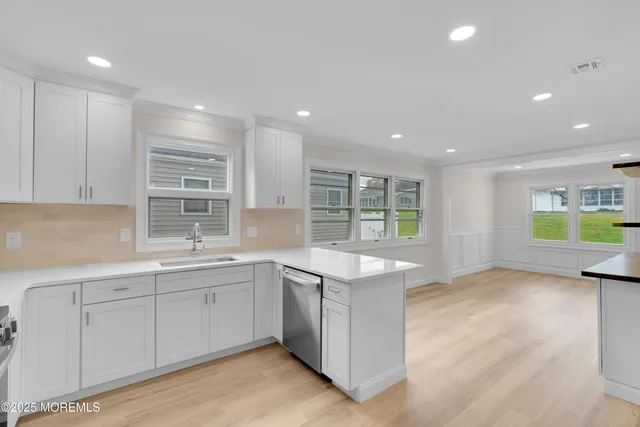 a kitchen with a sink counter top space and cabinets