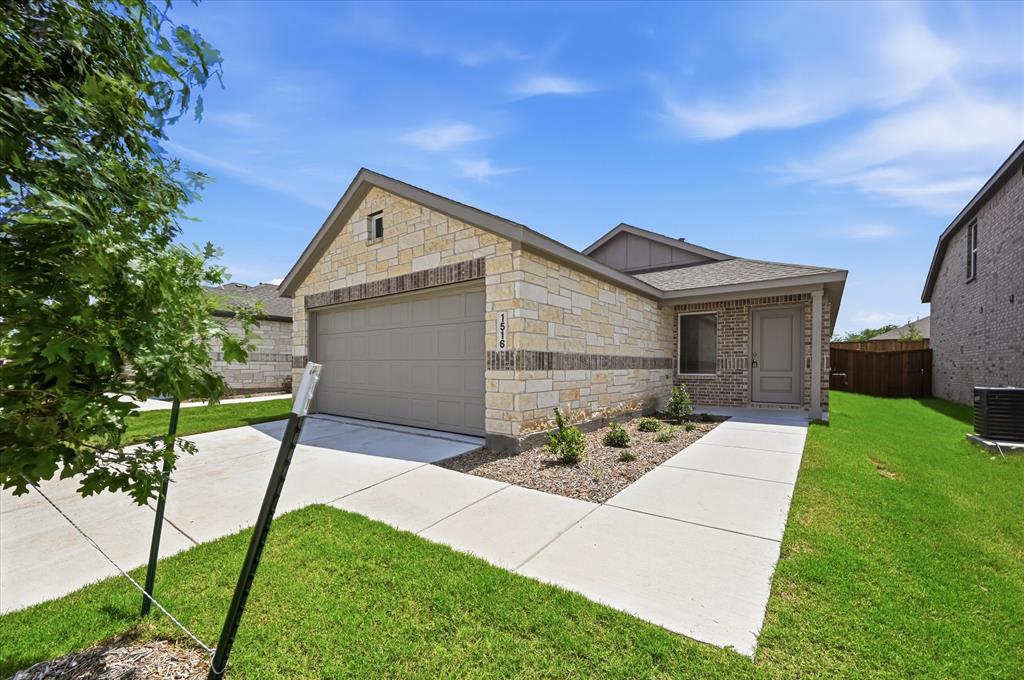 1516 Prince Road Howe, TX 75459 - Photo 4 of 28 a front view of a house with garden