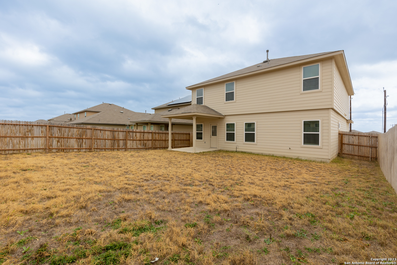 9819 Bratten Rise San Antonio, TX 78254 - Photo 36 of 37 a view of a house with a backyard