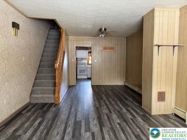 32 Powell Street Lansford, PA 18232 - Photo 4 of 12 a view of a hallway with wooden floor and staircase