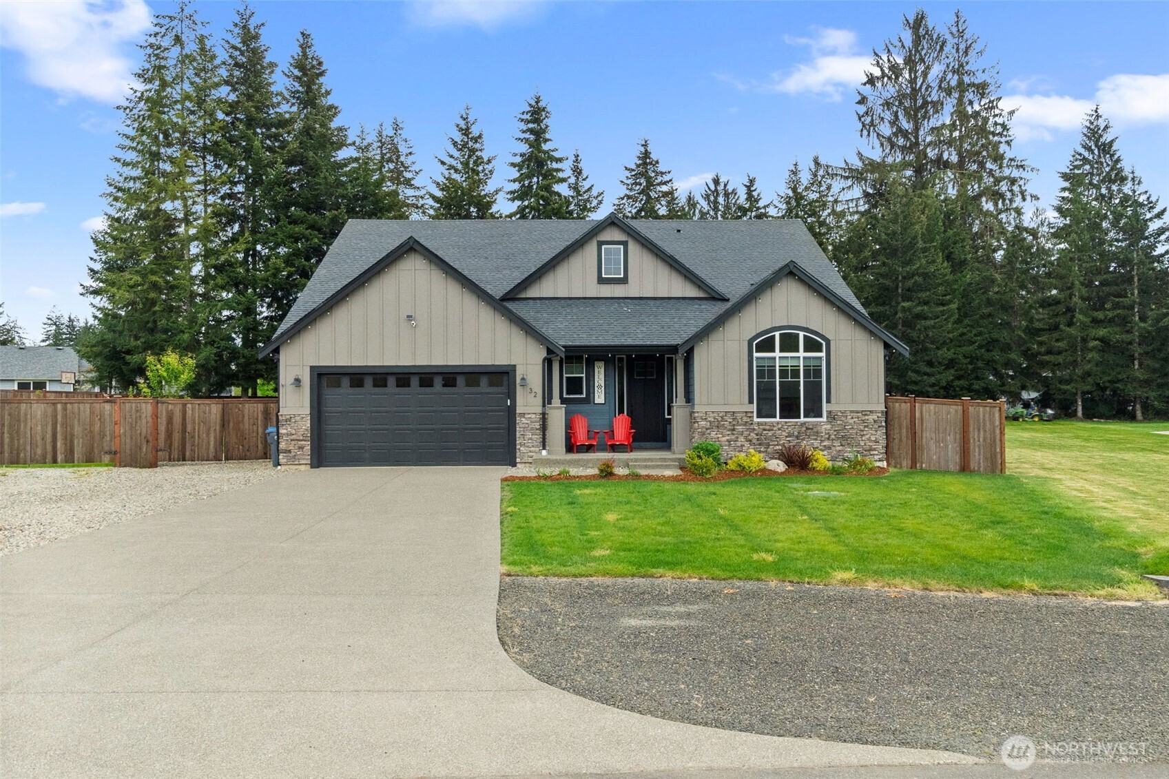 32 Coyote Road Montesano, WA 98563 - Photo 36 of 37 a front view of a house with a yard and trees