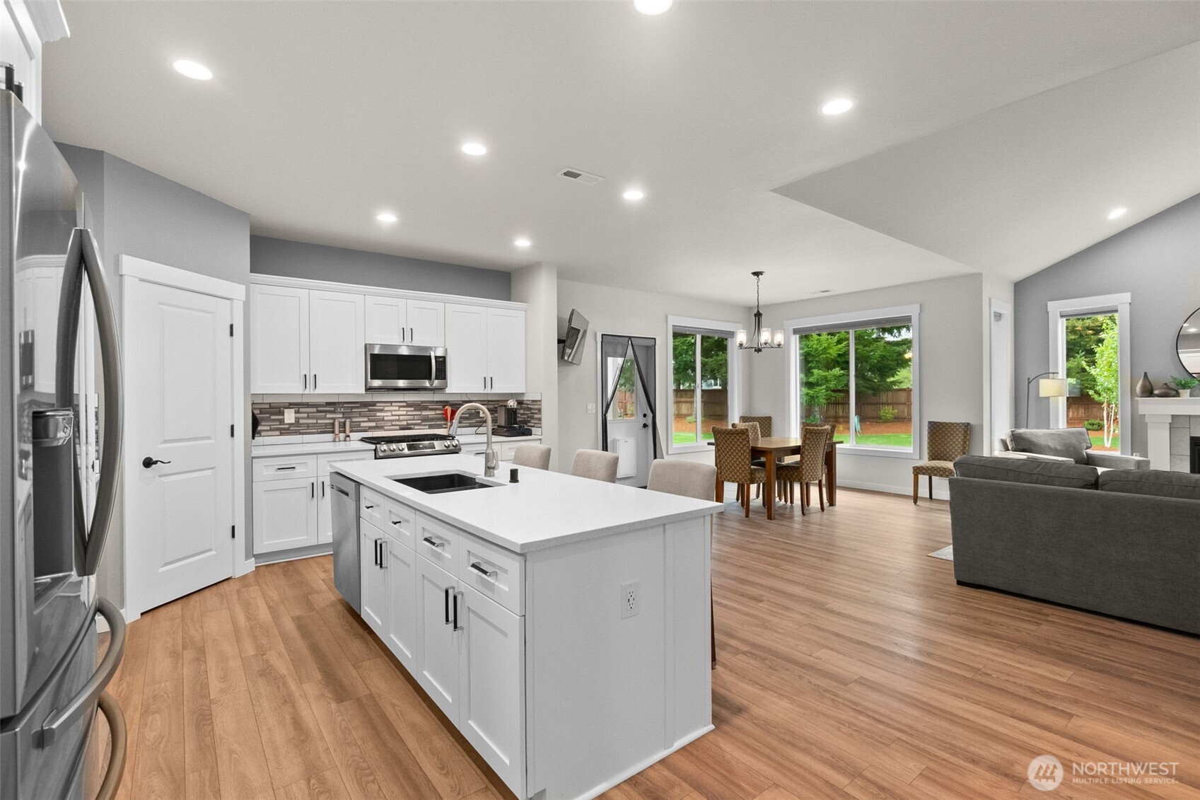 32 Coyote Road Montesano, WA 98563 - Photo 9 of 37 a large kitchen with stainless steel appliances a lot of counter space and wooden floor