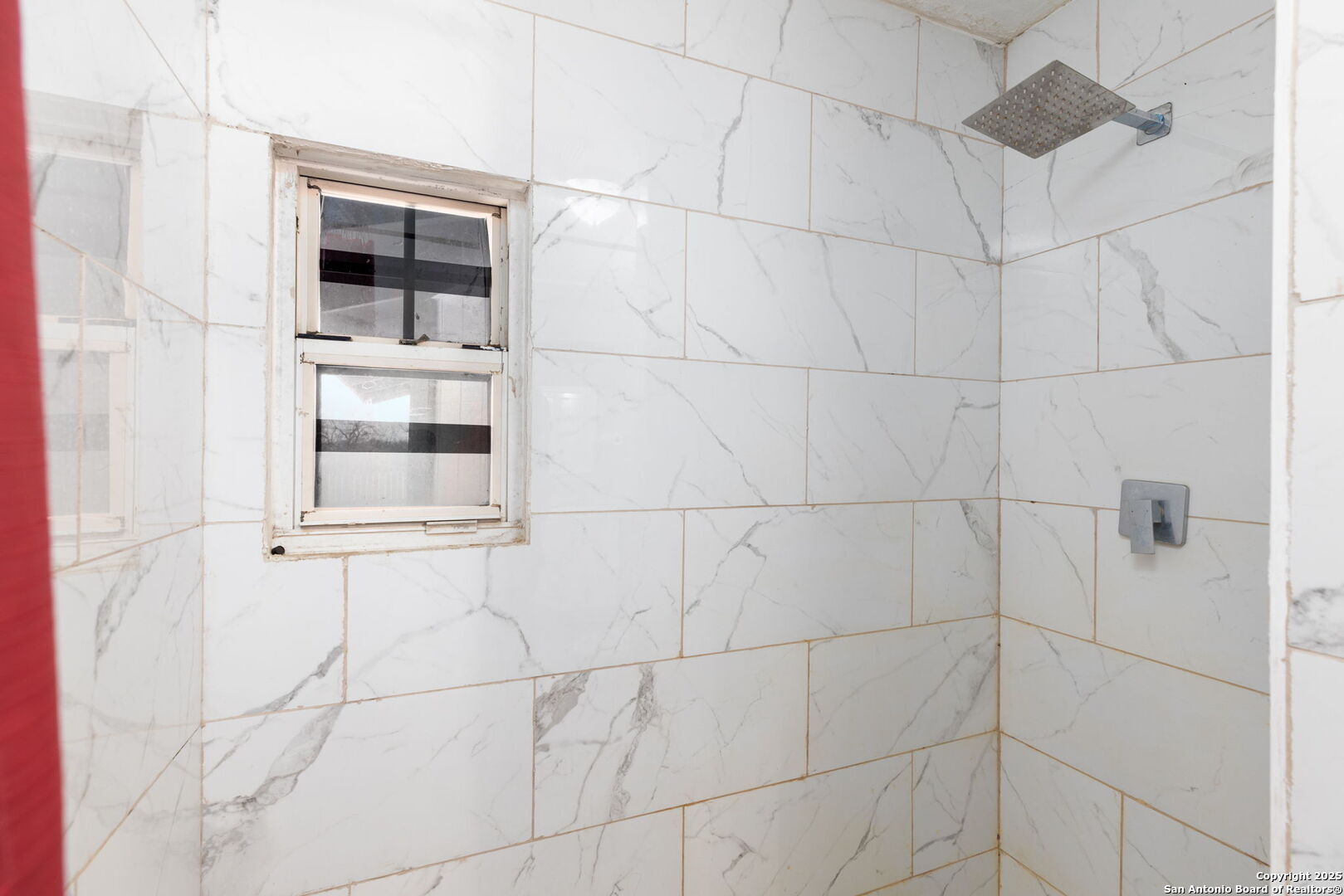 13934 Interstate 35 Moore, TX 78057 - Photo 17 of 29 a bathroom with a shower and a mirror