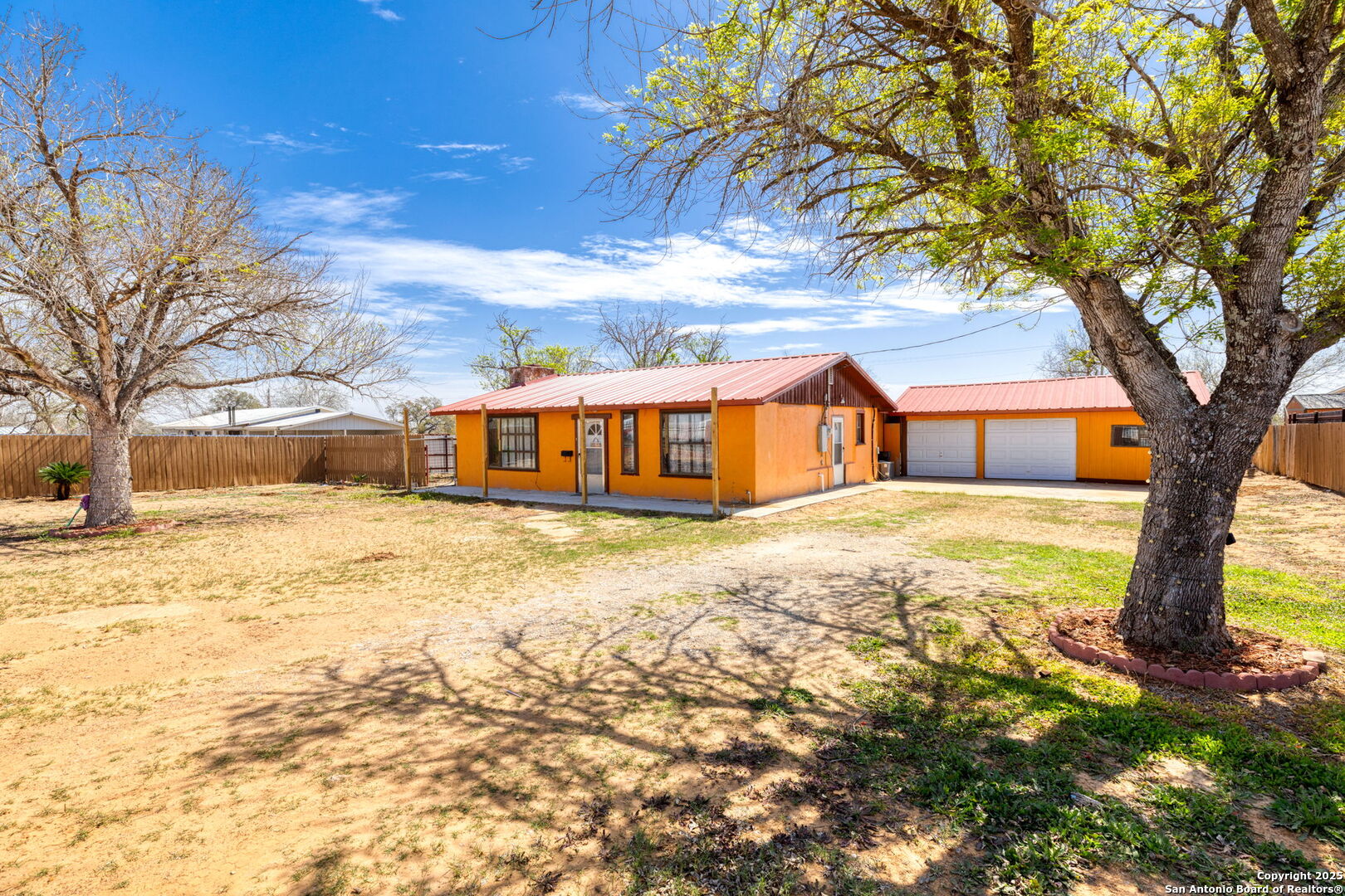 13934 Interstate 35 Moore, TX 78057 - Photo 2 of 29 a front view of a house with a yard