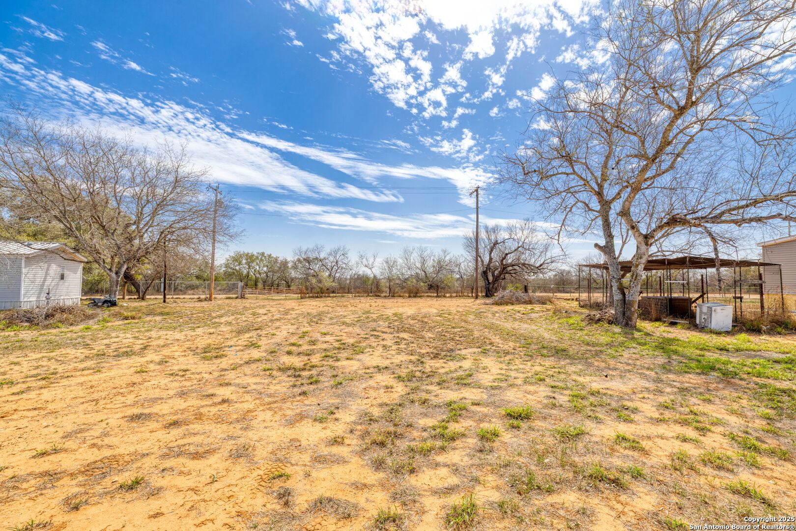 13934 Interstate 35 Moore, TX 78057 - Photo 26 of 29 a view of yard covered with snow in front of house