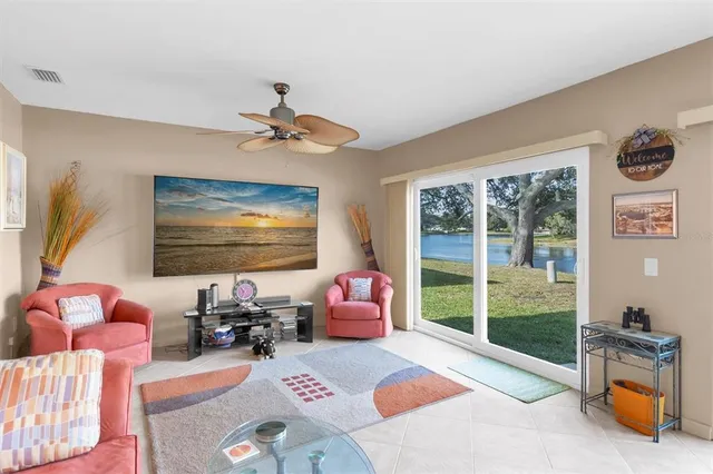 a bedroom with furniture and a flat screen tv