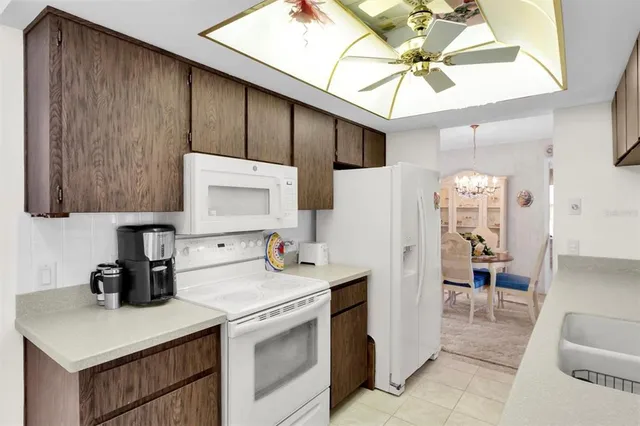 a view of a kitchen with a sink and cabinets