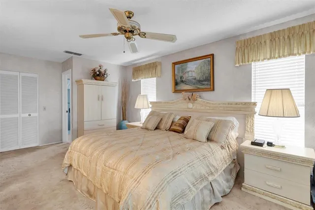 a bed room with a bed and a chandelier