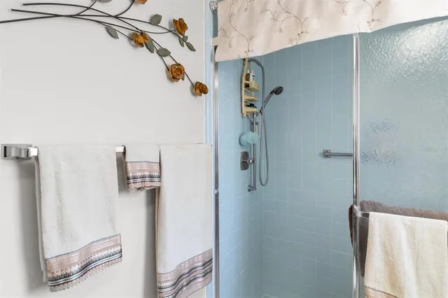 a bedroom with a bed and a night stand