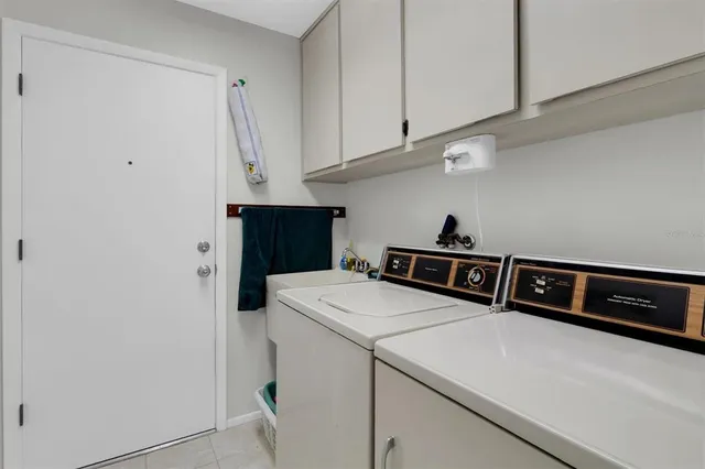 a view of a lake with houses in the back