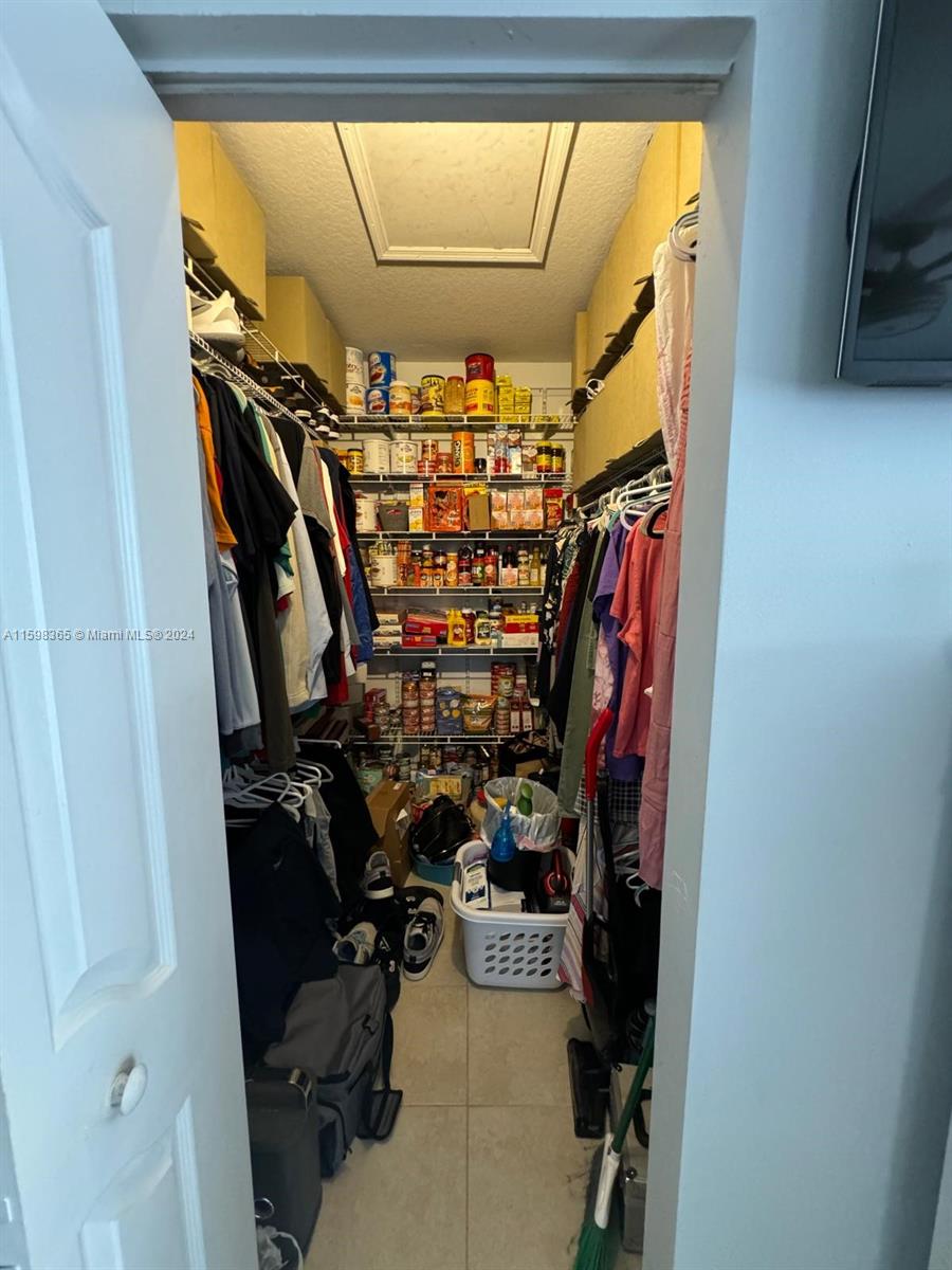 2841 Northeast 41st Place Homestead, FL 33033 - Photo 15 of 71 a view of a closet with storage and utility