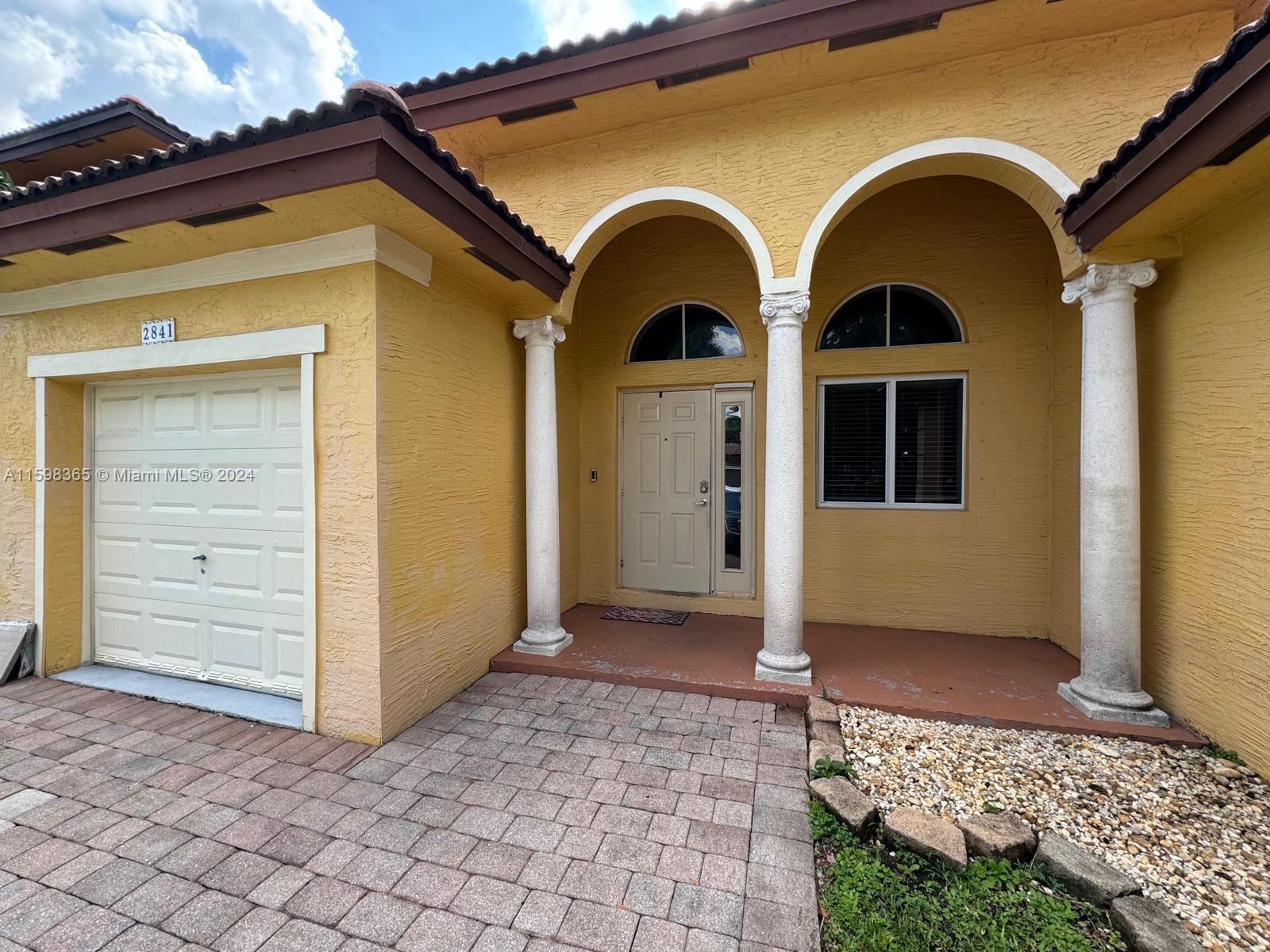 2841 Northeast 41st Place Homestead, FL 33033 - Photo 2 of 71 a view of an entrance of the house