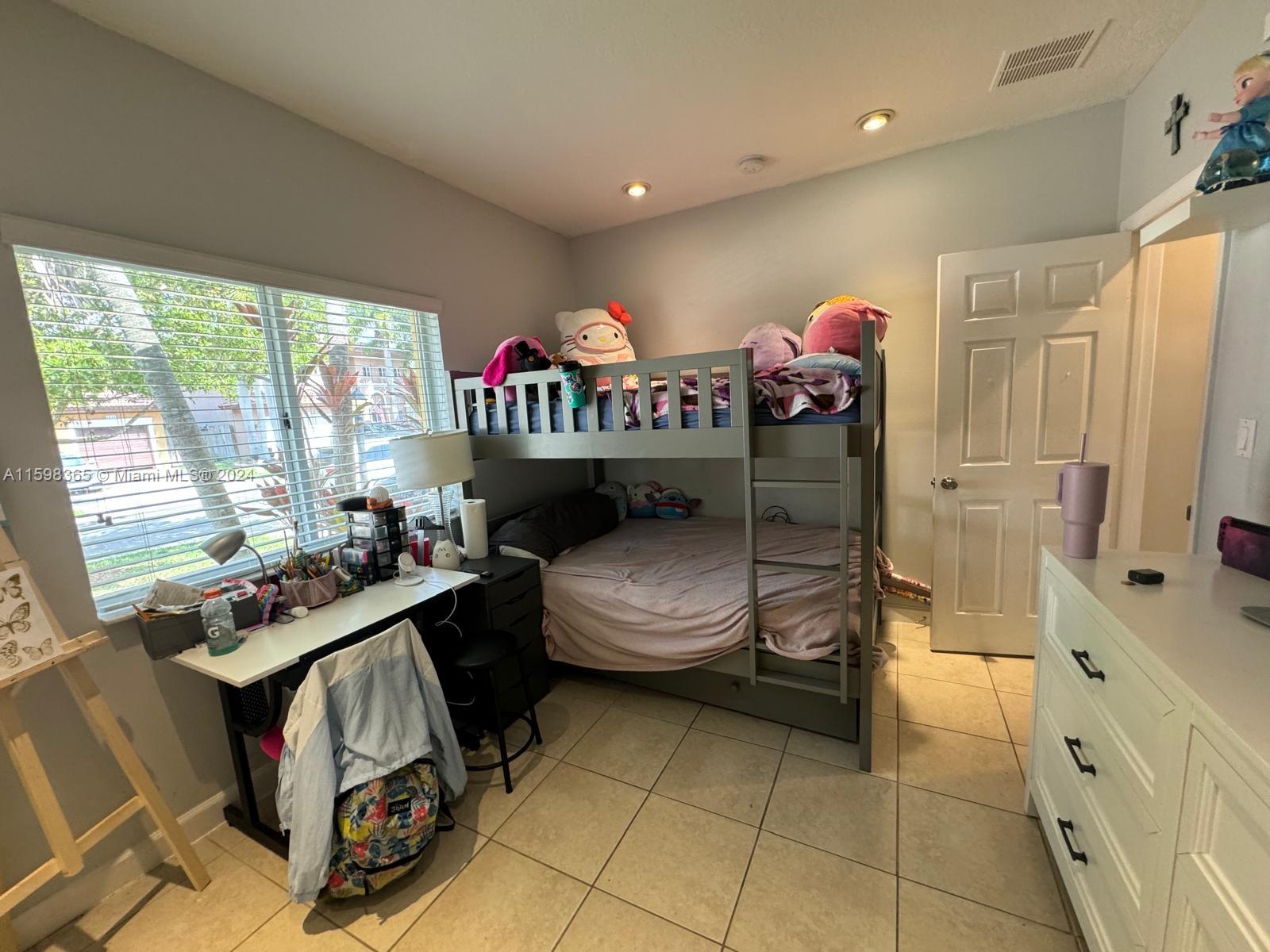 2841 Northeast 41st Place Homestead, FL 33033 - Photo 38 of 71 a bedroom with furniture and a window