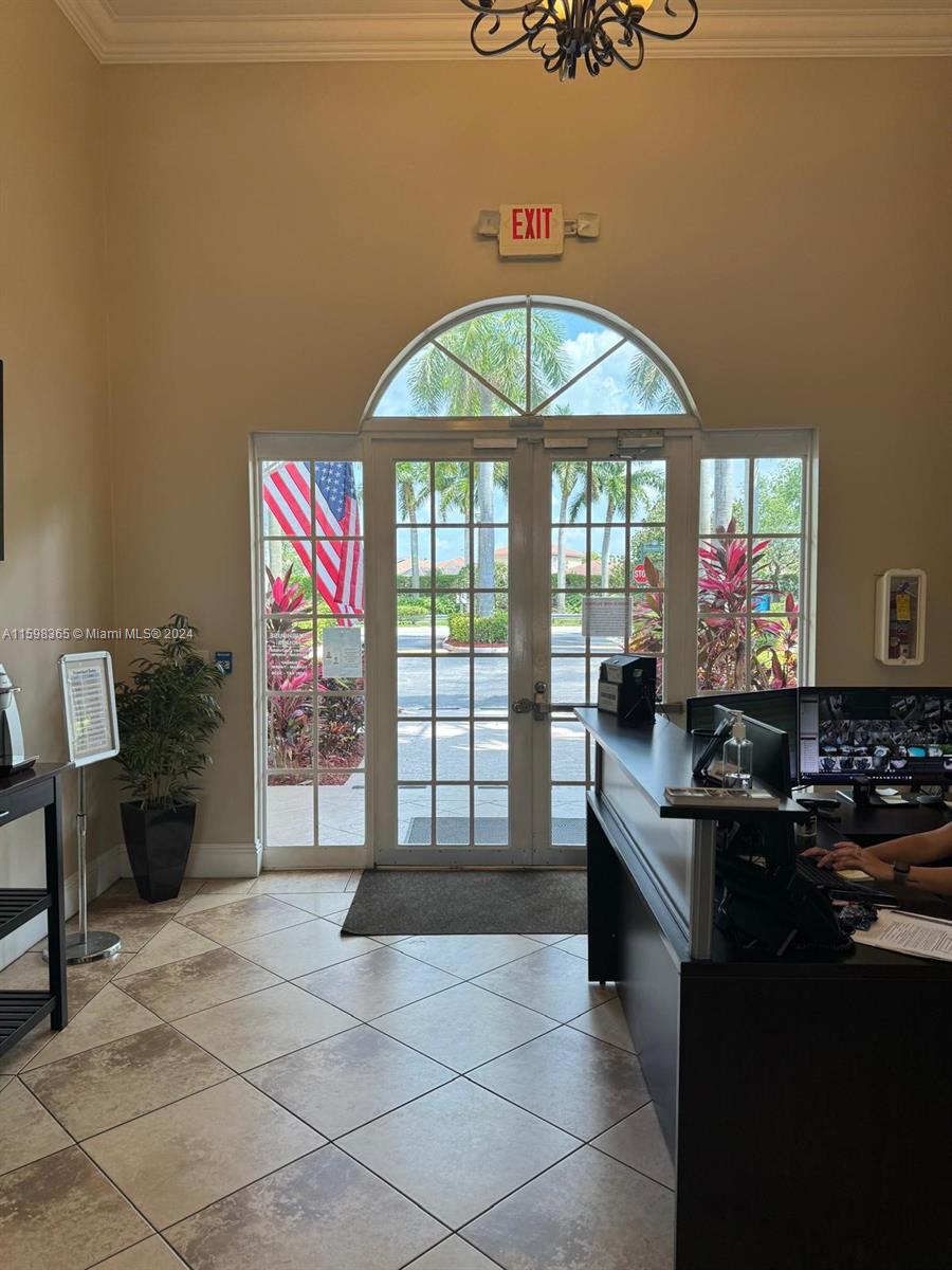 2841 Northeast 41st Place Homestead, FL 33033 - Photo 56 of 71 a kitchen with stainless steel appliances granite countertop a stove a sink and a microwave
