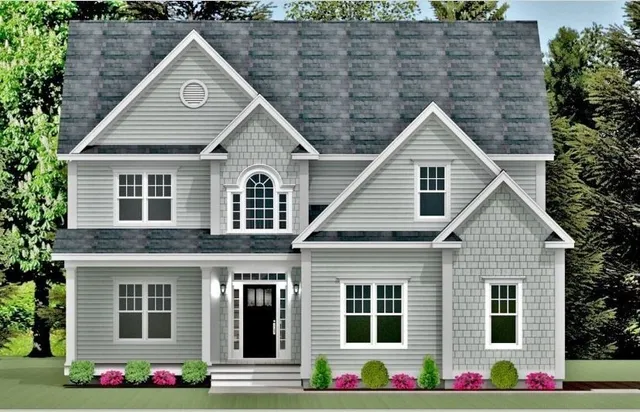 a front view of multi story residential apartment building with yard