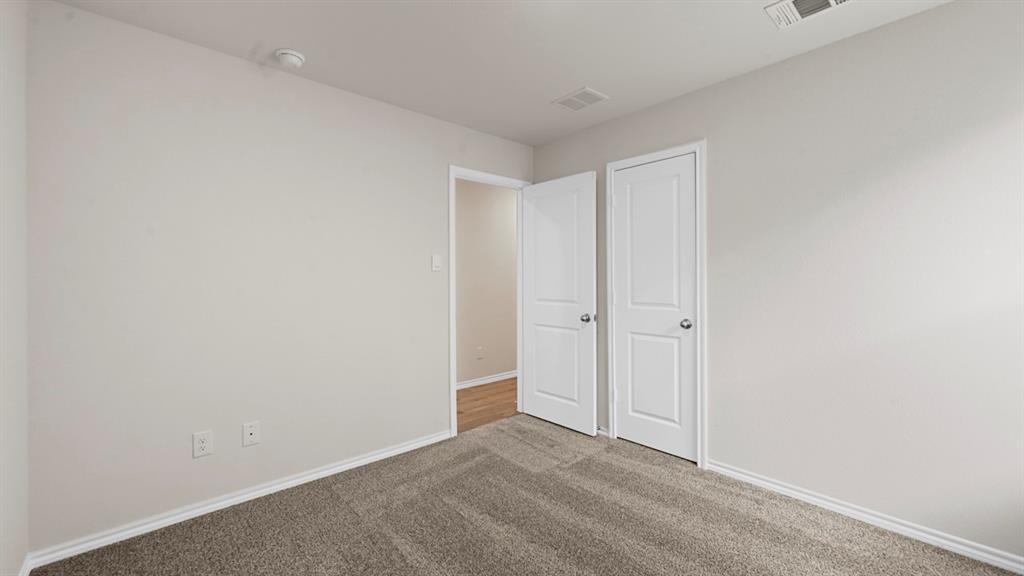 1663 Blaire Drive Tyler, TX 75704 - Photo 21 of 26 Carpeted room featuring light neutral wall paint and white trim
