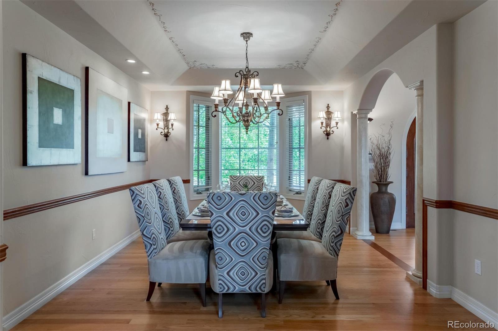 2671 Ranch Reserve Ridge Westminster, CO 80234 - Photo 12 of 35 a view of a dining room with furniture window and wooden floor