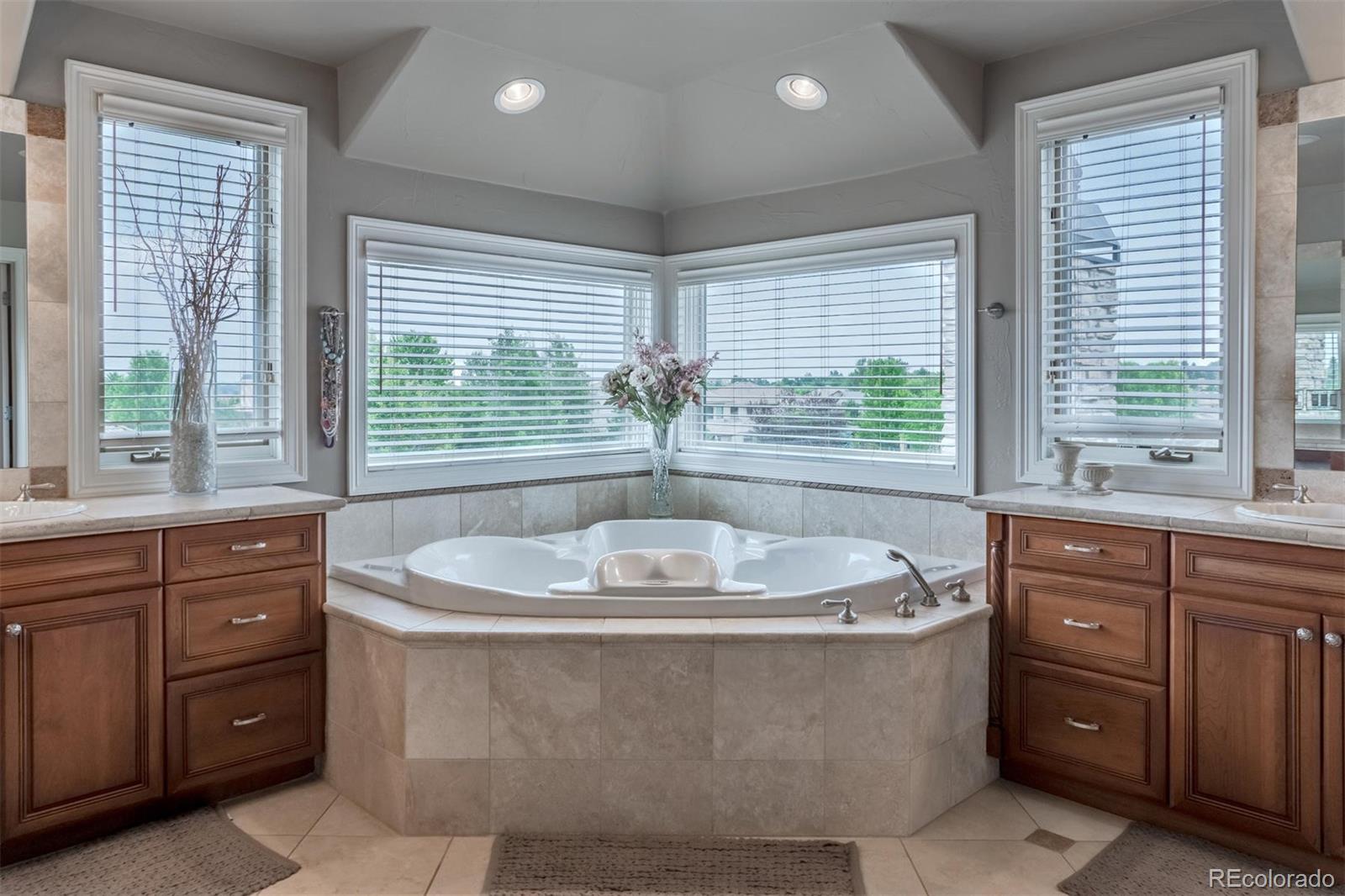 2671 Ranch Reserve Ridge Westminster, CO 80234 - Photo 15 of 35 a bath tub sitting in a bathroom next to a sink