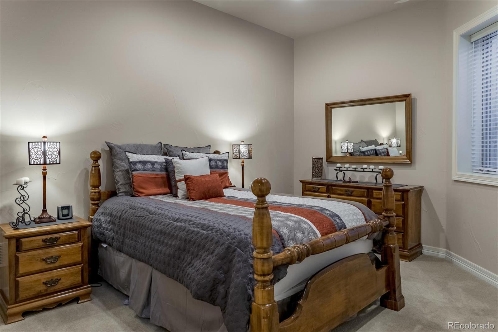 2671 Ranch Reserve Ridge Westminster, CO 80234 - Photo 20 of 35 a bedroom with a bed and a dresser in it