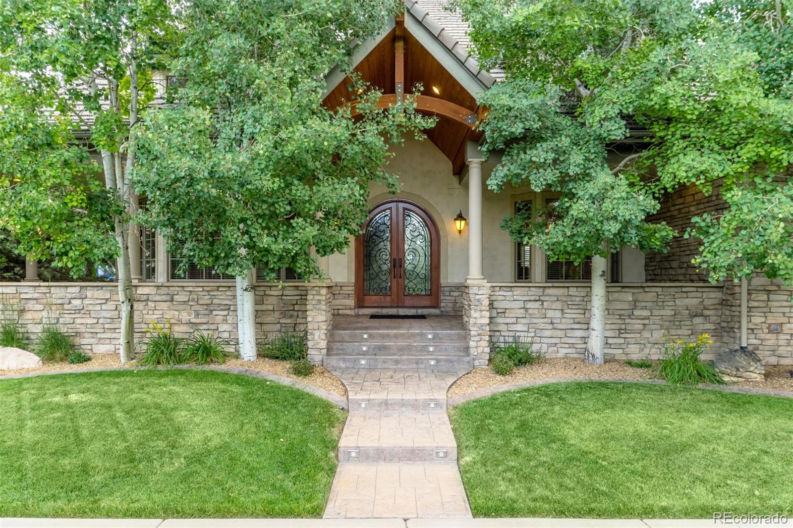 2671 Ranch Reserve Ridge Westminster, CO 80234 - Photo 2 of 35 a front view of a house with garden