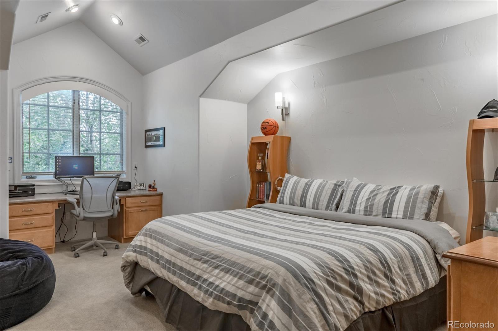 2671 Ranch Reserve Ridge Westminster, CO 80234 - Photo 25 of 35 a bedroom with a bed and a chair