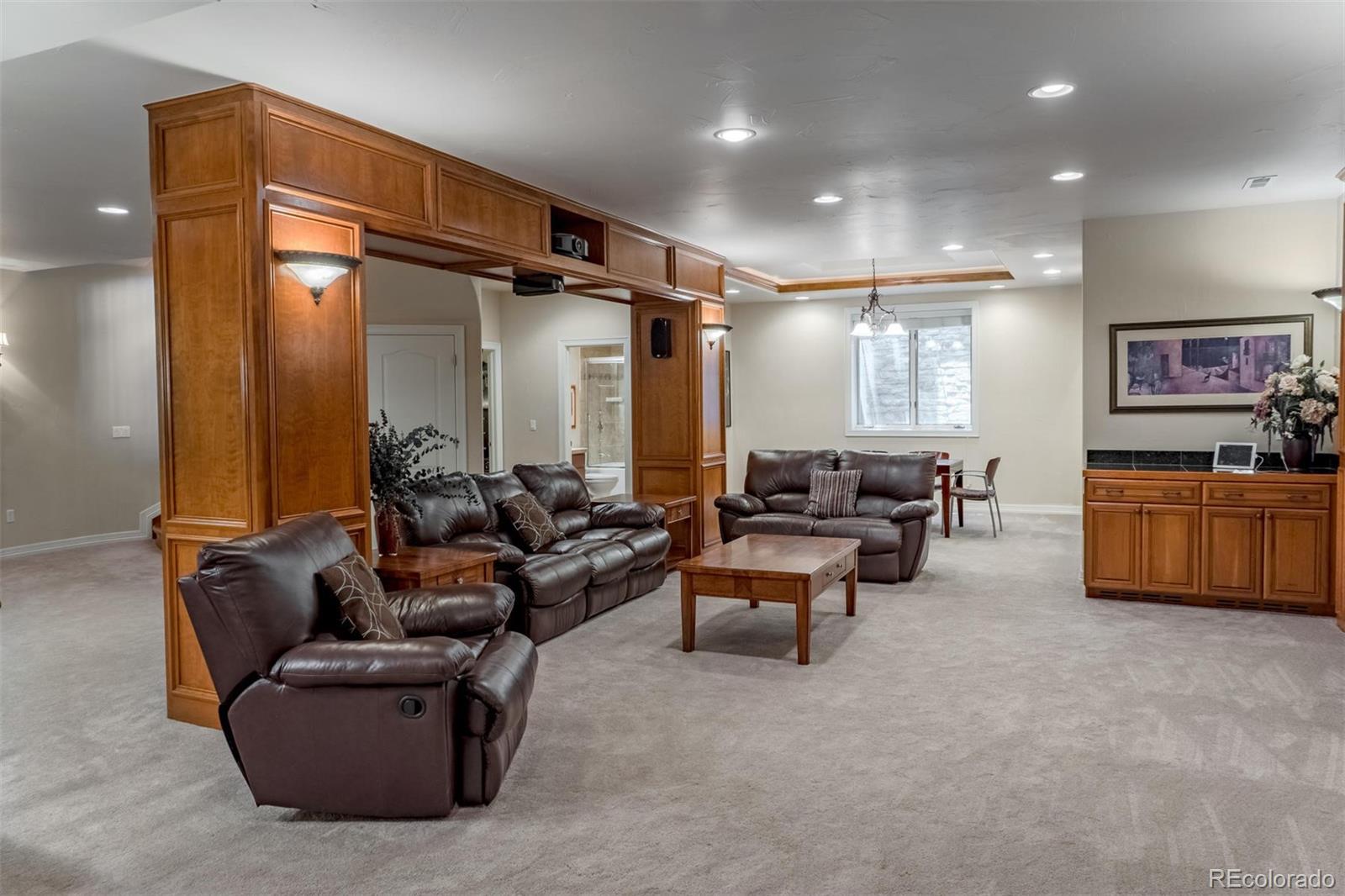 2671 Ranch Reserve Ridge Westminster, CO 80234 - Photo 27 of 35 a living room with furniture and a flat screen tv