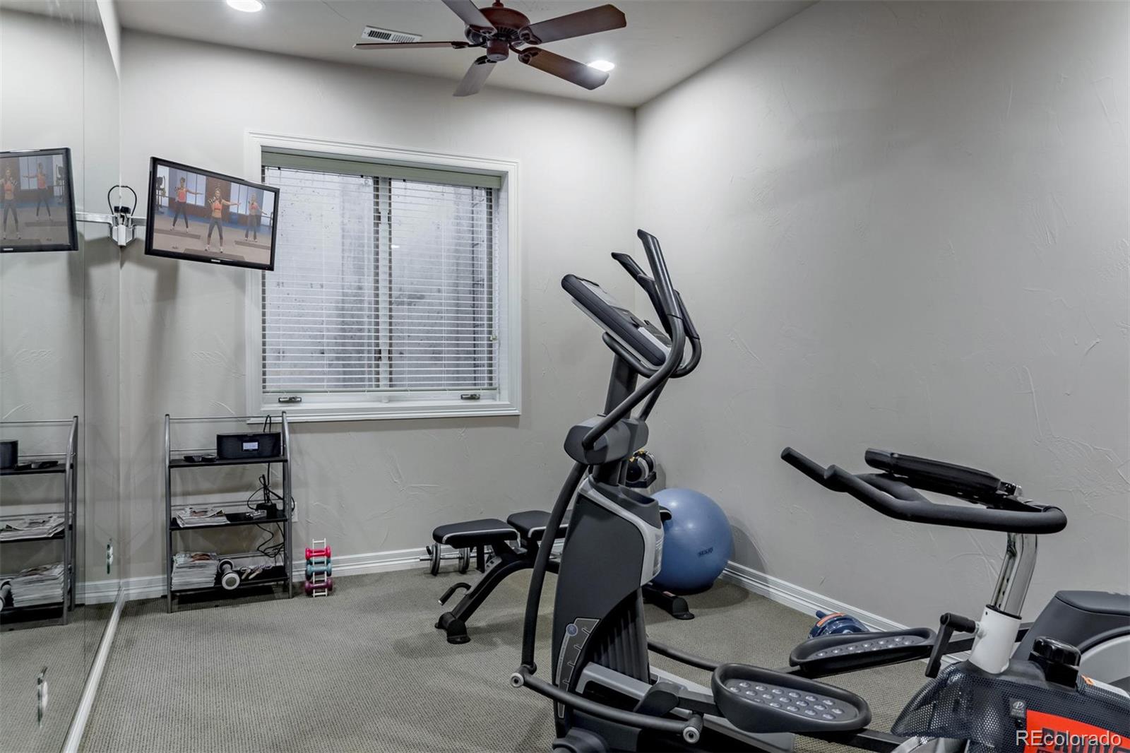 2671 Ranch Reserve Ridge Westminster, CO 80234 - Photo 30 of 35 a view of a room with gym equipment