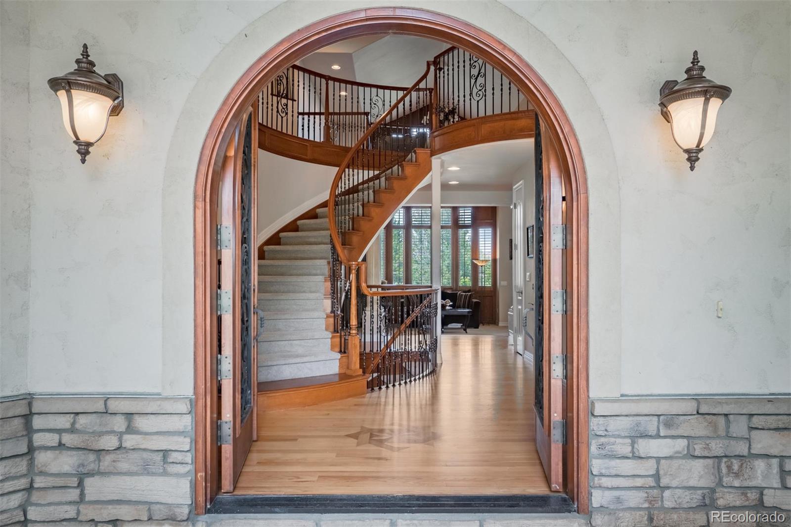 2671 Ranch Reserve Ridge Westminster, CO 80234 - Photo 3 of 35 a view of staircase with wooden floor and a mirror