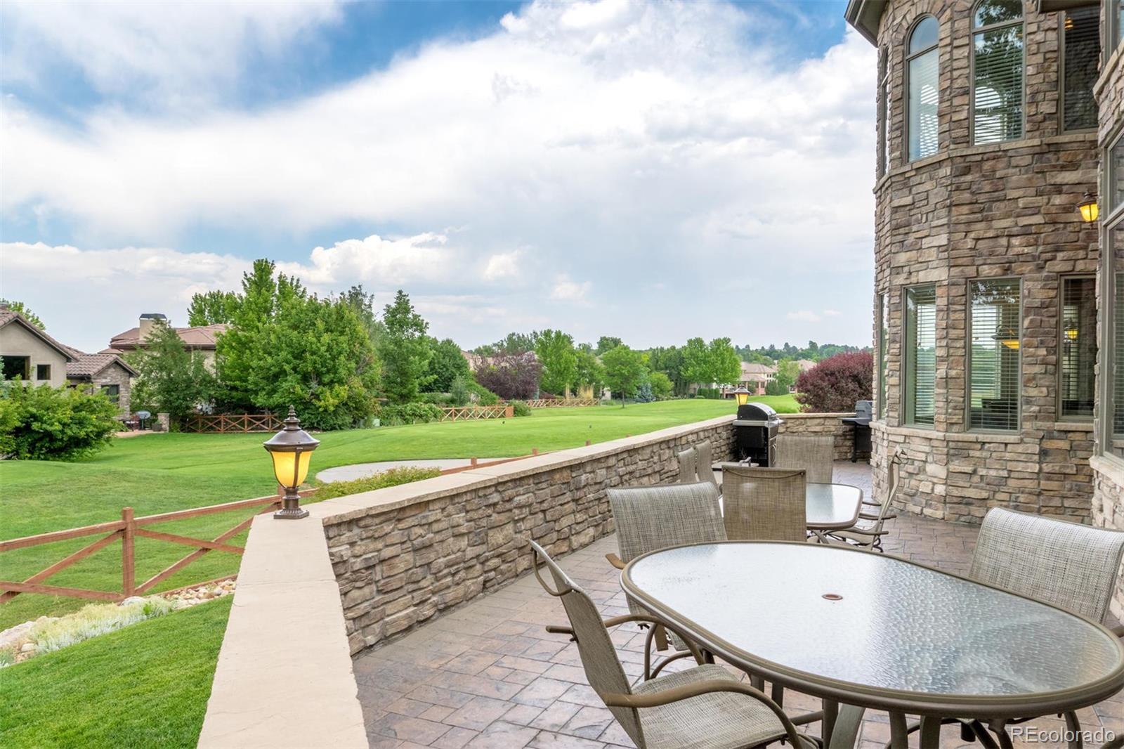 2671 Ranch Reserve Ridge Westminster, CO 80234 - Photo 31 of 35 a swimming pool with outdoor seating and garden