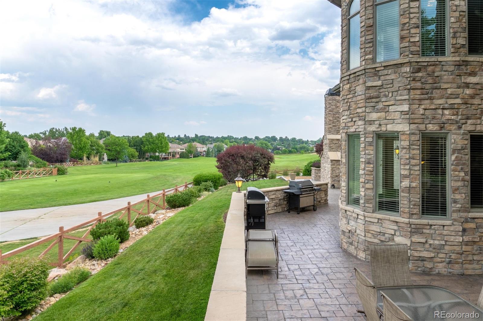 2671 Ranch Reserve Ridge Westminster, CO 80234 - Photo 32 of 35 a view of a patio with table and chairs potted plants with sky view