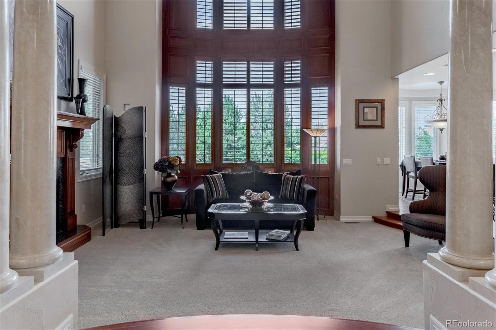 2671 Ranch Reserve Ridge Westminster, CO 80234 - Photo 33 of 35 a living room with furniture and a window