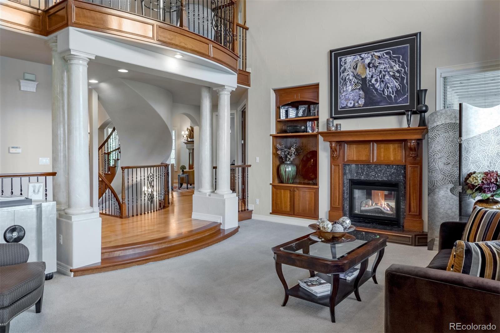 2671 Ranch Reserve Ridge Westminster, CO 80234 - Photo 6 of 35 a living room with furniture and a fireplace