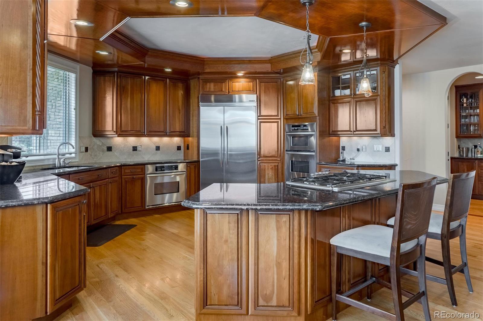 2671 Ranch Reserve Ridge Westminster, CO 80234 - Photo 7 of 35 a kitchen with stainless steel appliances granite countertop a sink and cabinets